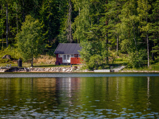 Fototapeta na wymiar Typical hut on a lake in Sweden