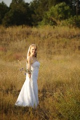 Fototapeta na wymiar Bride Posing in the Field