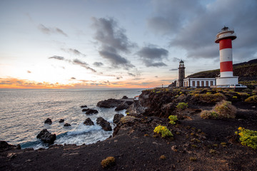Volcanic landscape with lighthouse near salt factory Fuencaliente on La Palma island in Spain
