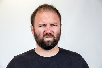 Fototapeta premium Man in Mid 30s Poses for Studio Portrait