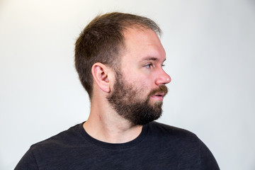 Obraz premium Man in Mid 30s Poses for Studio Portrait