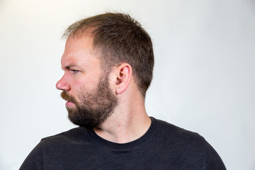 Fototapeta premium Man in Mid 30s Poses for Studio Portrait