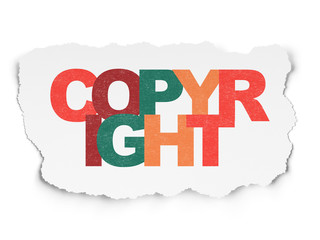 Law concept: Copyright on Torn Paper background