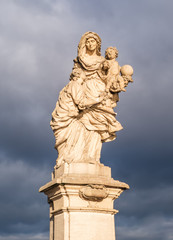 St. Anne holds blessed little Jesus and Virgin Mary. Statues on the Charles Bridge in Prague, Czech