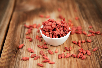 Goji berries in a white china bowl on a table