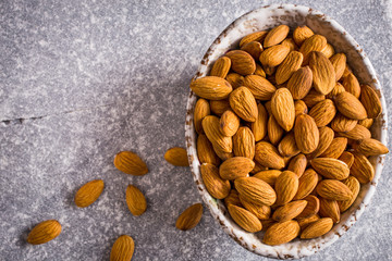 Bowl of almonds above