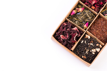 assortment of dry tea in a box, isolated on white