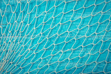 Fishing net over blue background