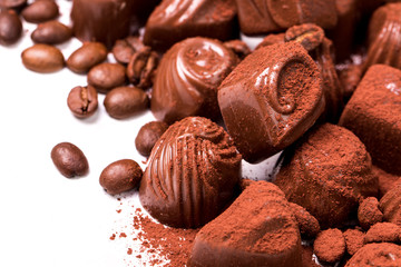 Delicious chocolate candies on wooden background