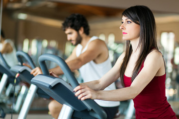     Group of people running on treadmills