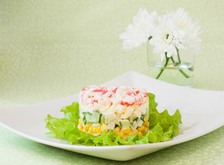 Layered salad of crab sticks and canned corn