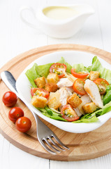 Caesar salad, sauce and cherry tomatoes