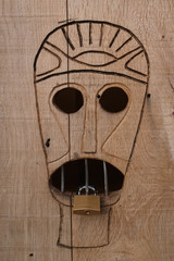 African mask on door