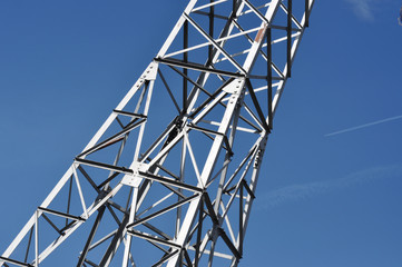 Electricty power tower against blue sky