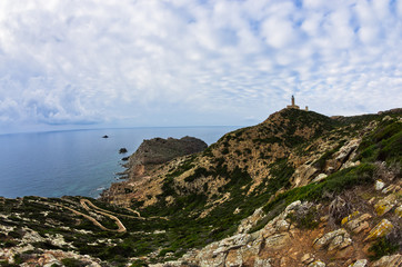 Lighthouse at Capo Sandalo on west coast of San Pietro island, Sardinia, Italy