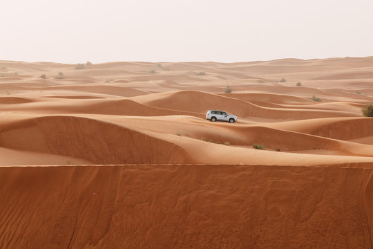 Sand dunes of the Arabian desert, close to Dubai in the United Arab Emirates. Soft vintage editing. Picture taken on a desert safari.