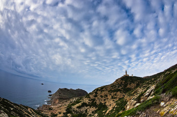 Lighthouse at Capo Sandalo on west coast of San Pietro island, Sardinia, Italy