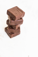 Chocolate candies on white table