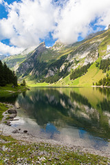 Naklejka na ściany i meble Stunning view of Seealpsee (lake) and the Alpstein massif
