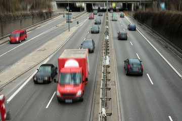 Cars on a Highway.Vehicle traffic on a busy city road in perspective.