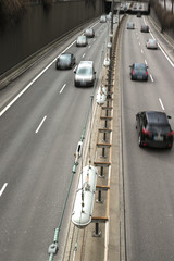 Cars on a Highway.Vehicle traffic on a busy city road in perspective.