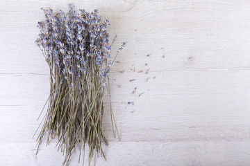 Lavender flowers in close up on wood background with space