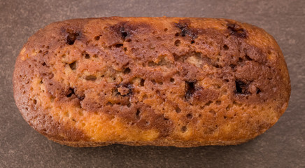  cake with jam on light brown background 