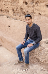 Young arab man with braces