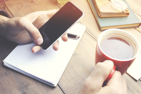 Man Hand Coffee  And Phone