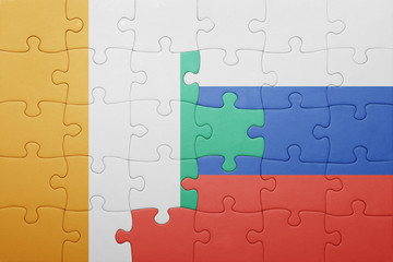 puzzle with the national flag of russia and cote divoire
