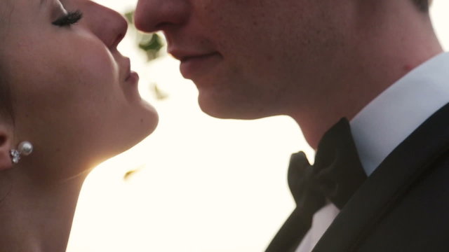Beautiful bride and groom tenderly kissing close up. Paris, wedding day