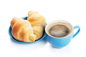Fresh croissants and coffee cup