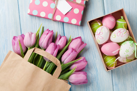 Colorful easter eggs and tulips
