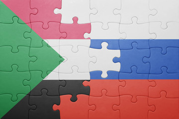 puzzle with the national flag of russia and sudan