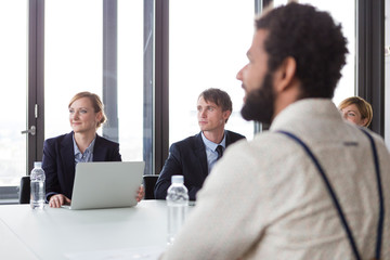 Business people having meeting in modern office.