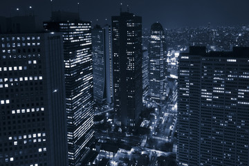 Modern business district with skyscrapers at night - 104782825