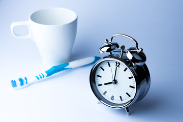 Metal Alarm clock work time on white background 10 am.