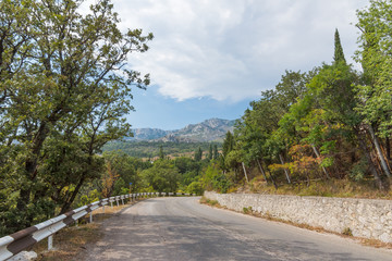 Summer landscape in the mountains with the road. Crimea mountain views array Ai-Petri from the old top South Coast Highway in Alupka on a summer day