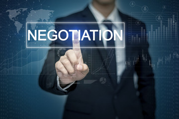 Businessman hand touching NEGOTIATION  button on virtual screen