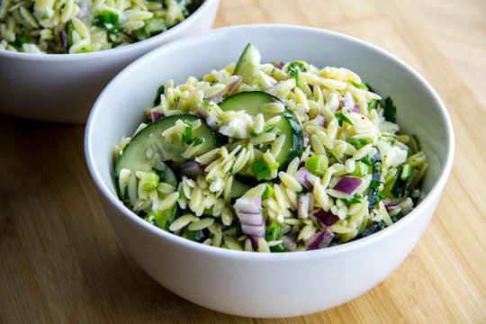 Freshly made orzo salad with cucumber, parsley, red onion and feta cheese