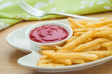 French fries with ketchup on plate