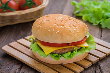 Hamburger on wooden plate