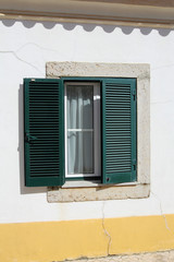 portuguese window with green shutter