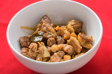 chinese herb pig legs boil on red background