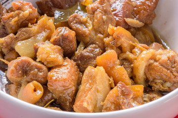 chinese herb pig legs boil on red background