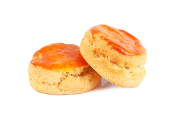 Two plain scones for afternoon tea isolated on white