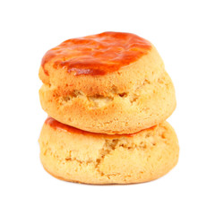 Two plain scones for afternoon tea isolated on white