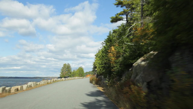 Driving on Sargent Drive along Somes Sound in Acadia National Park in Autumn.