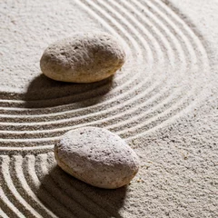 Fotobehang Zen Stenen zen sand still-life - textured stones set across sinuous waves for concept of different directions or change with inner peace, closeup  © STUDIO GRAND WEB