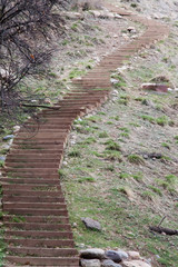 Obraz premium Curving wooden stairs on Centennial trail in CO - vertical